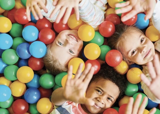 fancy-image Children’s play area with safe flooring and recreational equipment